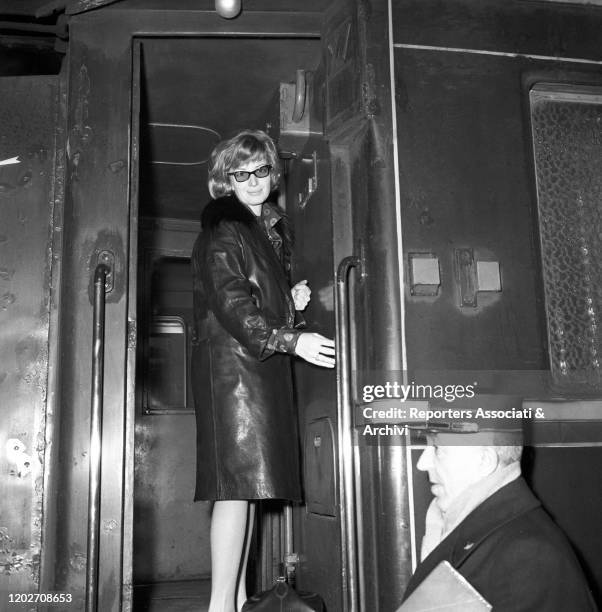 Italian actress Monica Vitti at Termini station, leaving for Paris. Rome, 1958