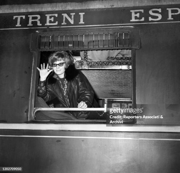 Italian actress Monica Vitti at Termini station, leaving for Paris. Rome, 1958