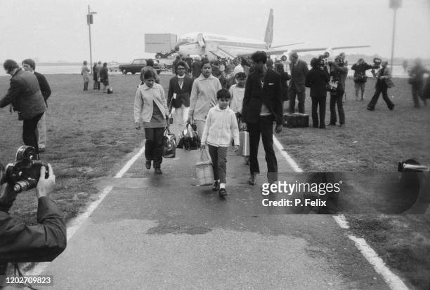 Ugandan Asian refugees arriving at Stansted Airport in Essex, 18th September 1972. They are some of the 27,000 Ugandan Asians to arrive in Britain...