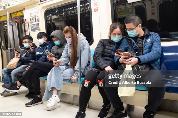 Commuters in the Taipei MRT system all wearing surgical mask as the 2019 Novel coronavirus that originated in China is spreading to other countries...
