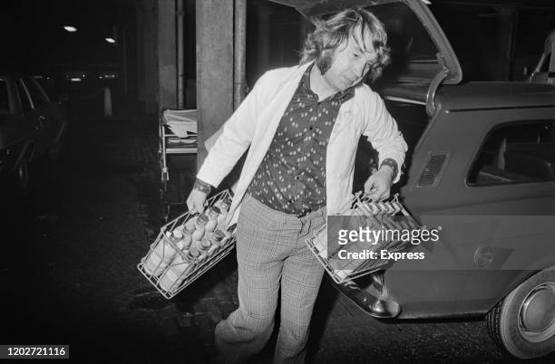 Milkman making deliveries in central Birmingham in the day after the Birmingham pub bombings which took place on 21st November 1974, in Birmingham,...
