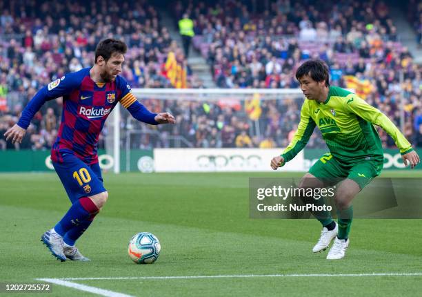 Leo Messi and Takashi Inui during the match between FC Barcelona and SD Eibar, corresponding to the week 25 of the Liga Santander, played at the Camp...