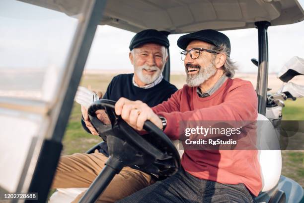 excited seniors going for a golf match - male golfer stock pictures, royalty-free photos & images