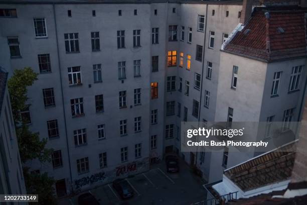 rear view of typical residential buildings in berlin, germany, at twilight - mitte photos et images de collection