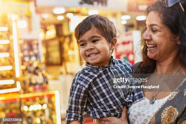 mother and son enjoying walk at bazaar - madhya pradesh stock pictures, royalty-free photos & images