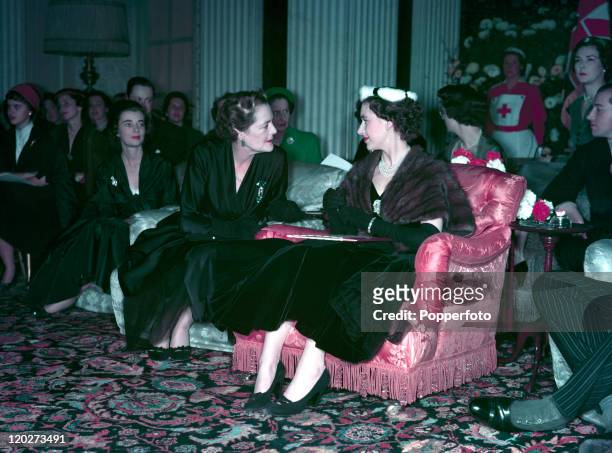 Princess Margaret chatting to the Duchess of Marlborough at the Dior Winter Collection fashion show in aid of the British Red Cross at Blenheim...