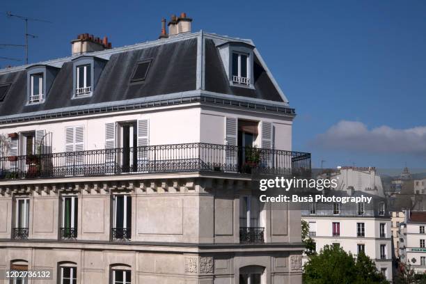 beautiful balcony of top floor of pre-war traditional residential building in paris, france - paris cityscape stock pictures, royalty-free photos & images