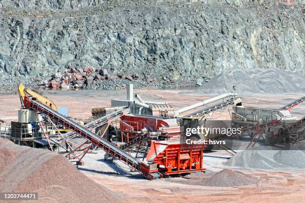 stone crusher and conveyor belt sorting rock material. quarry. mining industry. - metallic belt stock pictures, royalty-free photos & images