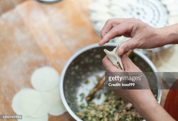 homemade cooking chinese dumpling(jiaozi) - chinese dumpling stock pictures, royalty-free photos & images