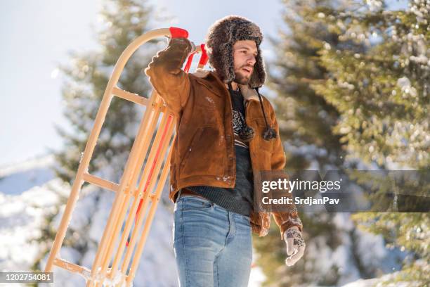 Man Riding Sled Man Sledding Photos and Premium High Res Pictures - Getty Images