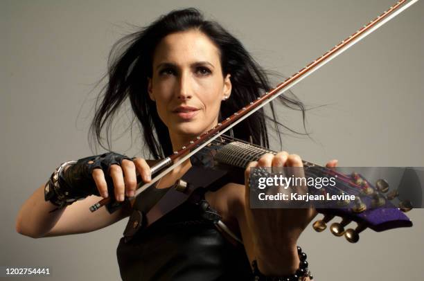 Violinist Asha Mevlana plays her electric violin on May 10, 2014 in New York City, New York.