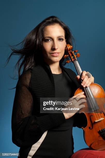 Violinist Asha Mevlana poses for a portrait with her violin on May 10, 2014 in New York City, New York.