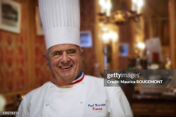 French Chef Paul Bocuse poses in his restaurant "Paul Bocuse" on February 8, 2011 in Collonges-au-Mont-d'Or near Lyon,France.