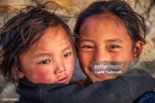 two tibetan young girls, upper mustang, nepal - tibetan ethnicity stock pictures, royalty-free photos & images