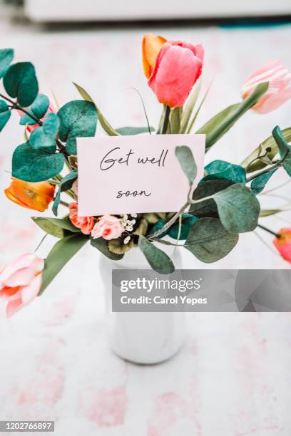 get well soon in card and envelope  with roses bouquet - get well card stockfoto's en -beelden