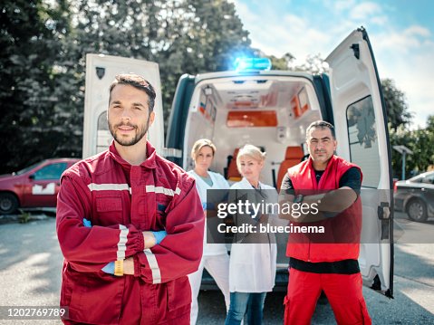 Emergency doctor and paramedic with ambulance