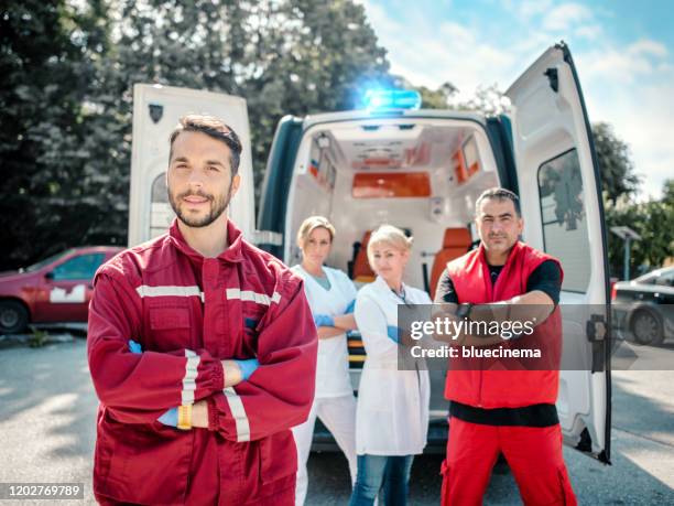 emergency doctor and paramedic with ambulance - red crescent stock pictures, royalty-free photos & images