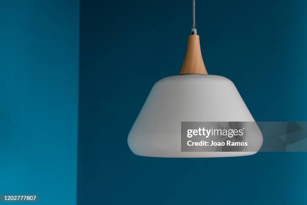 white modern chandelier on blue wall - 2 - シャンデリア ストックフォトと画像