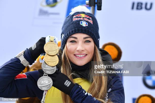 Italian Dorothea Wierer poses with all the medals she won in the world cup, after placing second of the Women 12.5 km Mass Start Competition at the...