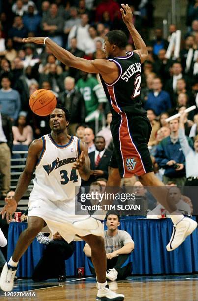 Washington Wizards' Charles Oakley blocks Utah Jazz's DeShawn Stevenson's attempt at a three-point shot to tie the game during the last four seconds...