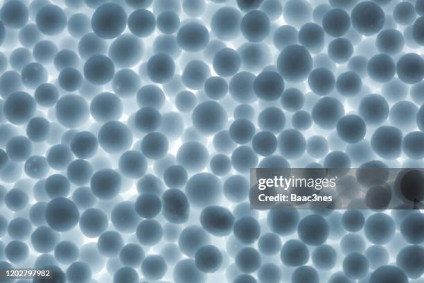 large group of polystyrene balls with back lit - granule stock pictures, royalty-free photos & images