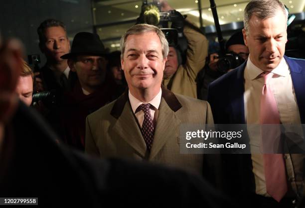 Brexit Party leader and member of the European Parliament Nigel Farage departs following a historic vote for the Brexit agreement at a session of the...