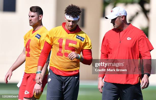Patrick Mahomes speaks with quarterback coach Mike Kafka during the Kansas City Chiefs practice prior to Super Bowl LIV at Baptist Health Training...