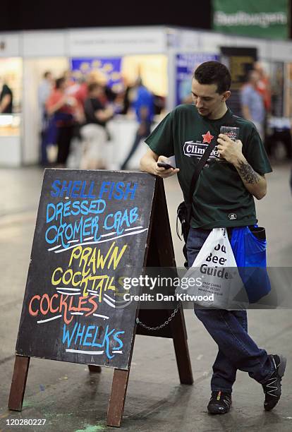 Member of the public attends the CAMRA Great British Beer festival on August 3, 2011 in London, England. The 5-day event is Britain's largest beer...