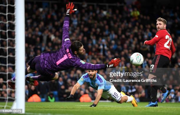 Sergio Aguero of Manchester City has a header saved by David De Gea of Manchester United during the Carabao Cup Semi Final match between Manchester...