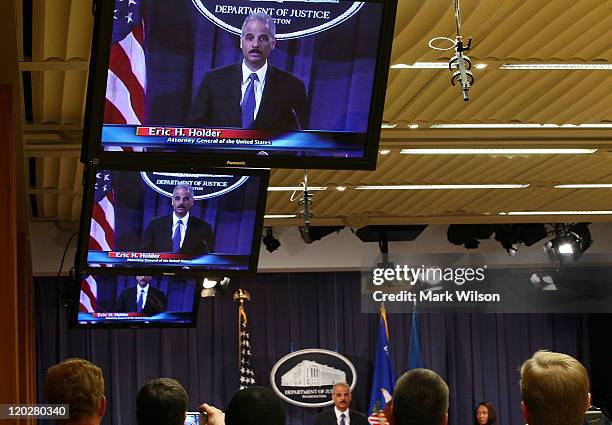 Attorney General Eric Holder speaks about an international child pronography investigation during a news conference at the Justice Department on...