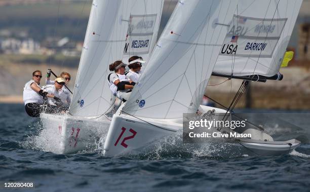 Sally Barkow, Alana O'Reilly and Elizabeth Kratzig-Burnham of the USA in action during a Womens Match Class race during day two of the Weymouth and...