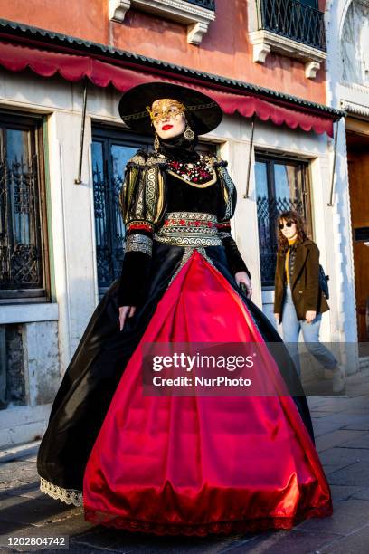 People with traditional costumes during the Carnival of Venice, in Venice, Italy, on February 21, 2020 due to concerns over coronavirus infection....