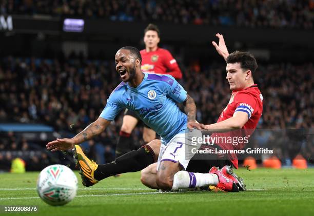 Harry Maguire of Manchester United tackles Raheem Sterling of Manchester City during the Carabao Cup Semi Final match between Manchester City and...