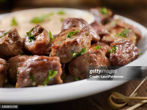 garlic and butter steak bites with a chipotle mayo dipping sauce - cocktail stick stock pictures, royalty-free photos & images