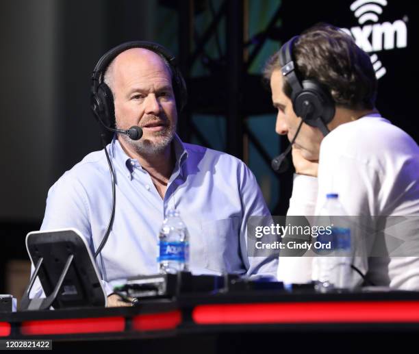 Journalist Rich Eisen and SiriusXM host, Chris "Mad Dog" Russo speak onstage during day 1 with SiriusXM at Super Bowl LIV on January 29, 2020 in...