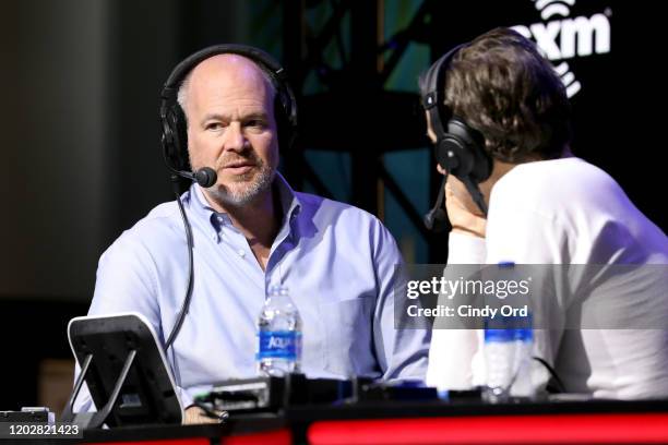 Journalist Rich Eisen and SiriusXM host, Chris "Mad Dog" Russo speak onstage during day 1 with SiriusXM at Super Bowl LIV on January 29, 2020 in...