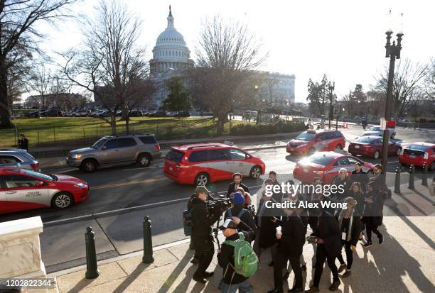 Surrounded by members of the media, Lev Parnas, former associate of Rudy Giuliani, walks on Constitution Avenue January 29, 2020 on Capitol Hill in...