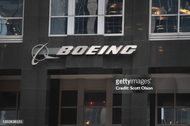 The company logo hangs above an entrance to the headquarters of The Boeing Company on January 29, 2020 in Chicago, Illinois. Boeing said today that...