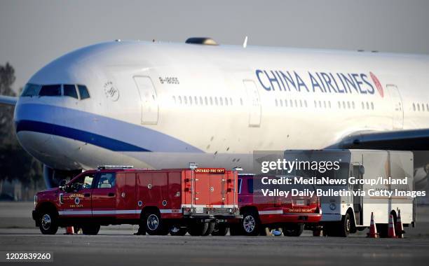 Ontario fire department paramedics watch as China Airlines flight 24 arrives at Ontario International Airport after arriving from Taipei, Taiwan...
