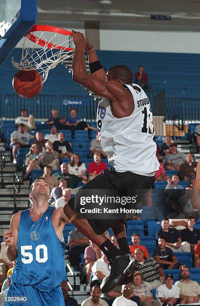 Amare Stoudemire of the Phoenix Suns slam dunks over Alex Jensen of the Dallas Mavericks during the Rocky Mountain Revue Summer League on July 23,...