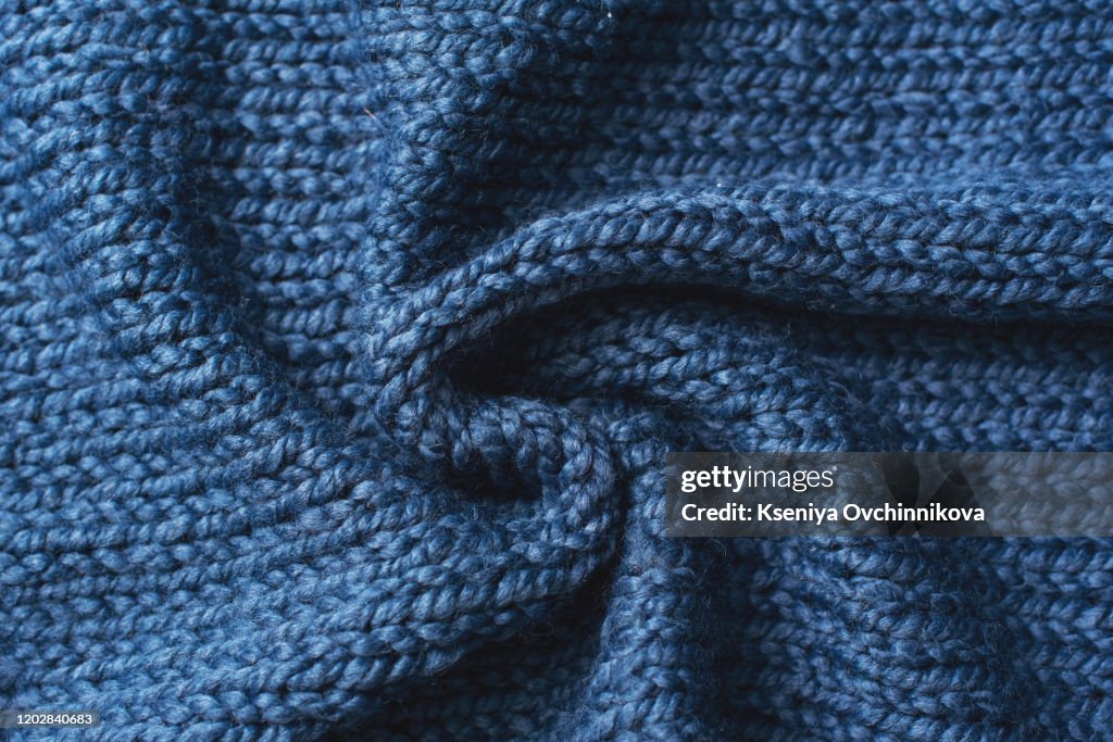 Blue knitted Jersey as textile background. Trendy classic blue color textule as color of year 2020 concept. Copy space for text and design.