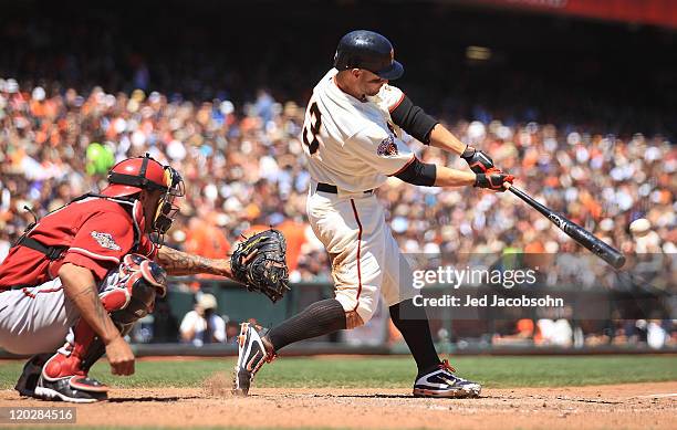 Cody Ross of the San Francisco Giants hits a two run double in the fifth inning against the Arizona Diamondbacks at AT&T Park on August 3, 2011 in...