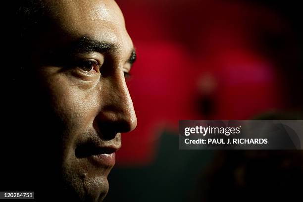 Chilean miner Carlos Barrios is interviewed during a press preview for the "Against All Odds" exhibition commemorating the rescue of 33 Chilean...