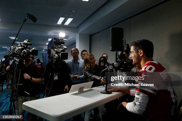 Jimmy Garoppolo of the San Francisco 49ers speaks to the media during the San Francisco 49ers media availability prior to Super Bowl LIV at the James...