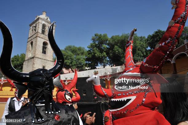 Dancers called Huehues take part during the traditional Carnival of Tlaxcala, disguised in traditional costumes of the region and wooden masks...