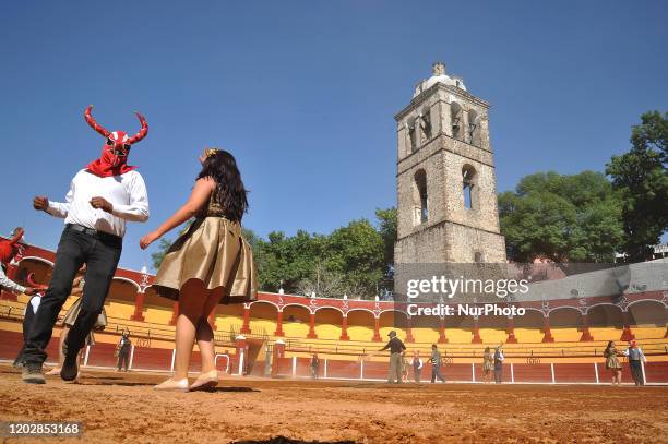 Dancers called Huehues take part during the traditional Carnival of Tlaxcala, disguised in traditional costumes of the region and wooden masks...