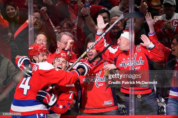 Oshie of the Washington Capitals celebrates with teammate Brenden Dillon after scoring a goal against the Pittsburgh Penguins in the third period at...