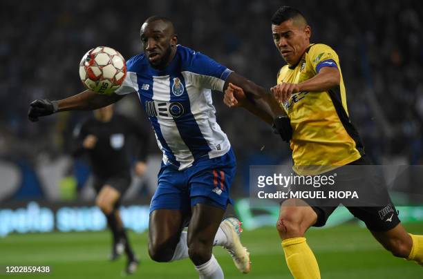 Porto's Malian forward Moussa Marega vies with Portimonense's Brazilian defender Jadson during the Portuguese league football match between FC Porto...