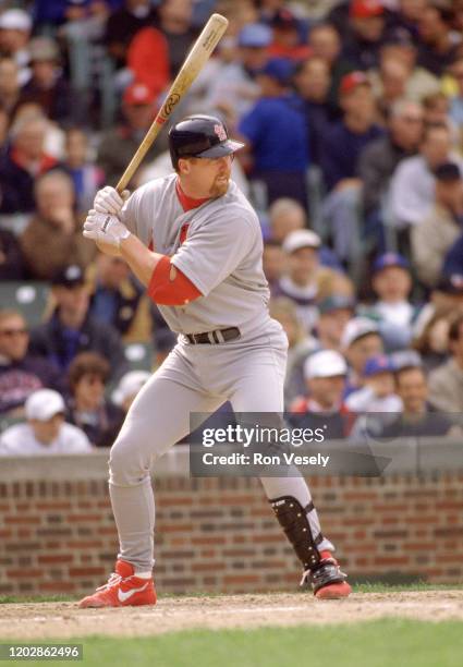 Mark McGwire of the St. Louis Cardinals bats during an MLB game at Wrigley Field in Chicago, Illinois. Mark McGwire played for 16 years with 2...