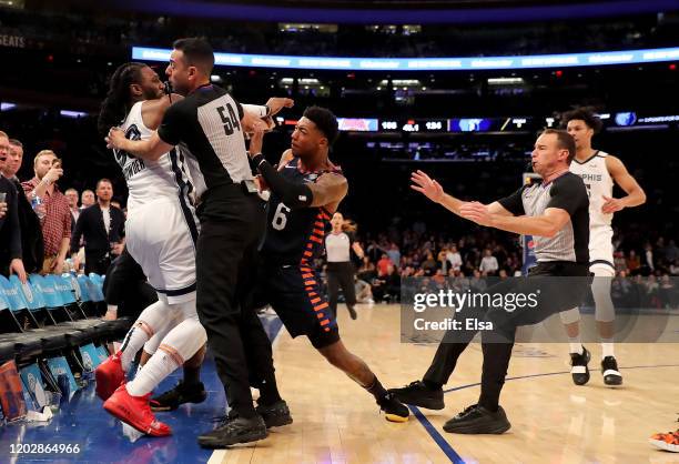 The referees try to break up a fight between Jae Crowder of the Memphis Grizzlies and Elfrid Payton of the New York Knicks in the final minute of the...